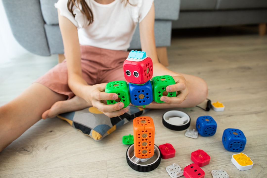 A colorful assortment of STEM toys including building blocks, science kits, and educational games suitable for children of various ages.